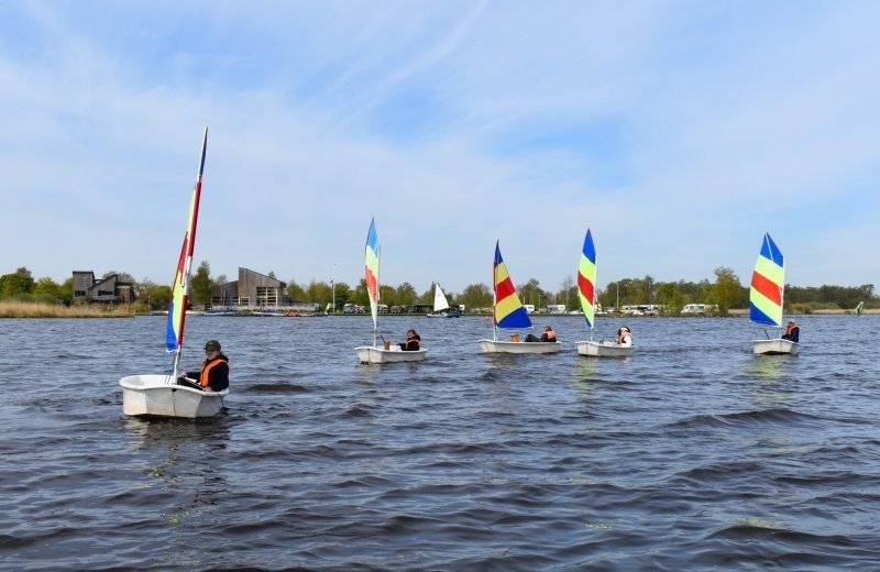 Youth sailing in an Optimist